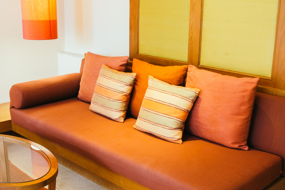 A casual sitting area with layered apricot colors. 